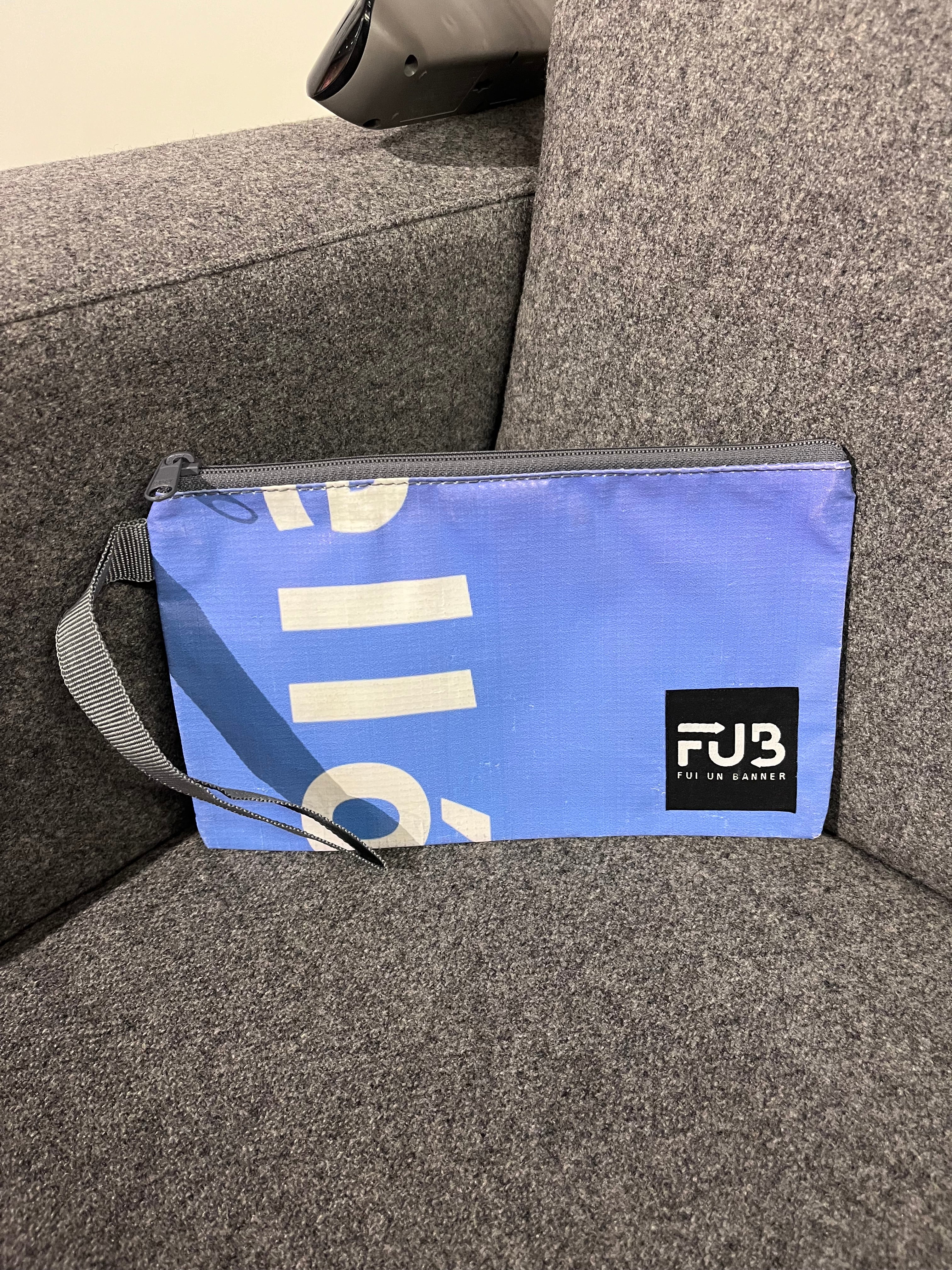 Organize your essentials in style with our FUB Pouch. This sustainable and unique pouch is made from recycled materials and supports ethical practices. Perfect for everyday use.