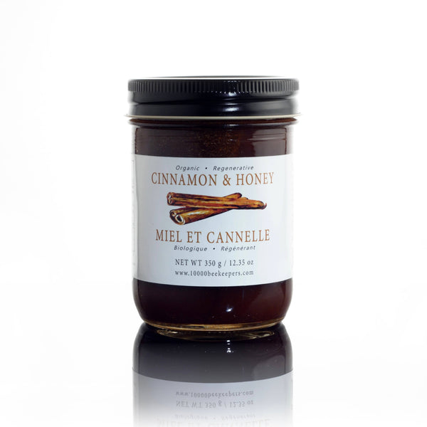 Organic cinnamon and honey spread in a reusable glass jar by African Bronze Honey Company