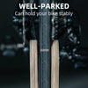 Bicycle tire with text indicating stability and tread depth on a dark background