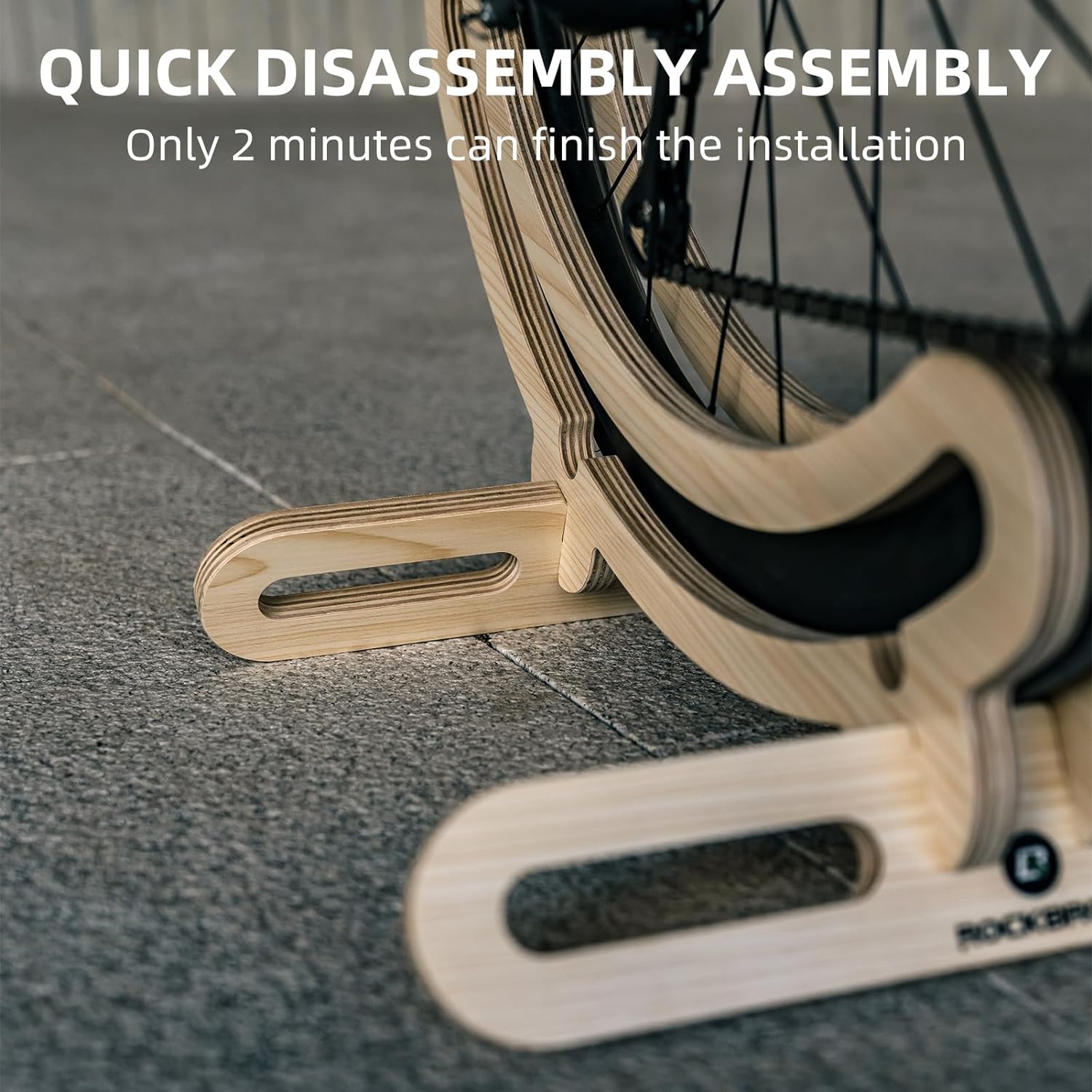 Quick disassembly assembly tool with bicycle wheel on a concrete floor