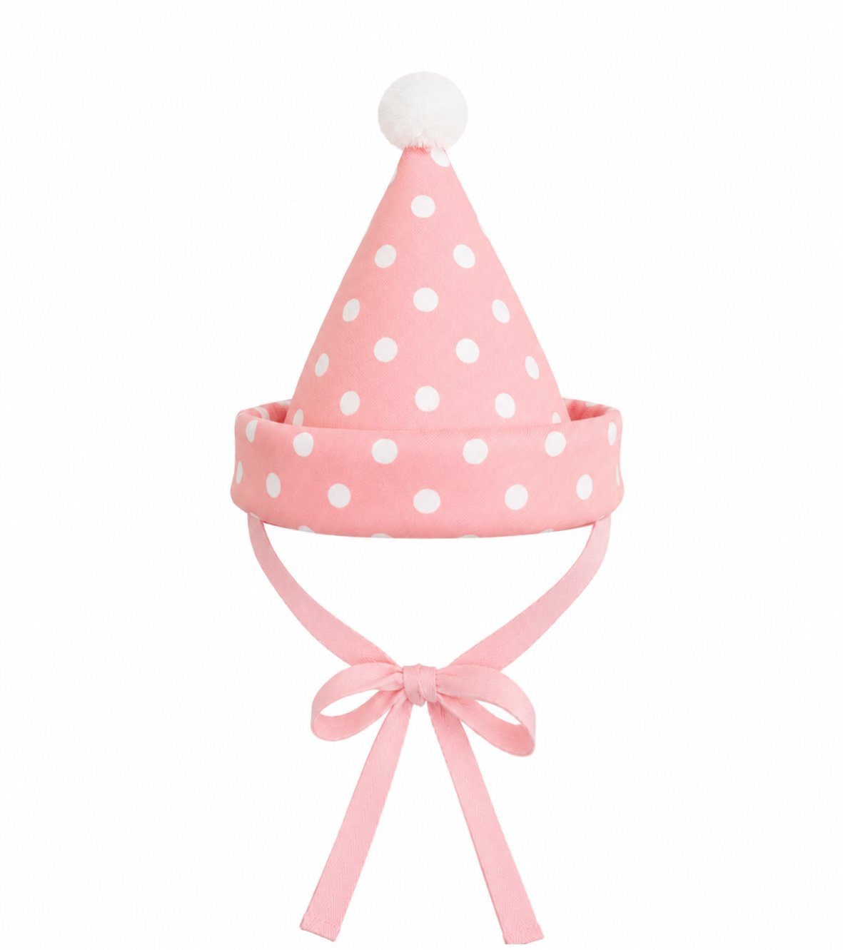 Pink polka-dot party hat with white pom-pom top and cotton chin tie ribbon