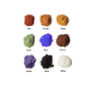 Assorted colors of powder including red, orange, yellow, green, blue, brown, purple, black, and white on a white background.