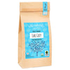 Tea package with blue label and tree design on a white background