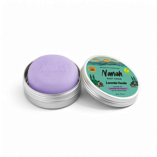Purple body cream in a silver container with a green label on a white background. NANAH Lavender Vanilla body cream bar — shea butter, vitamin E & lavender extract. Calming, anti-inflammatory & baby-safe. Replaces 2 bottles. Perfect gift. Shop now.