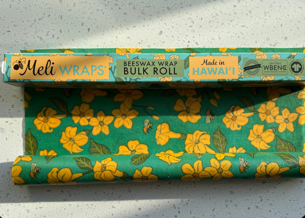 Puakenikeni & Bee print beeswax wrap covering a dish