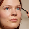 Close-up of Mother of Lashes mascara wand showing precision-molded brush bristles