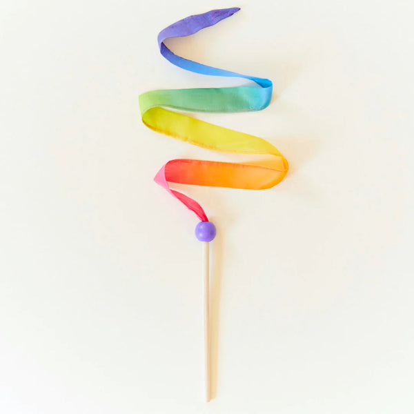 Colorful ribbon on a stick against a white background