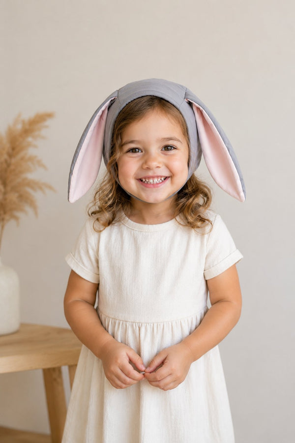 Gray Bunny Bonnet costume hat displayed on a flat surface