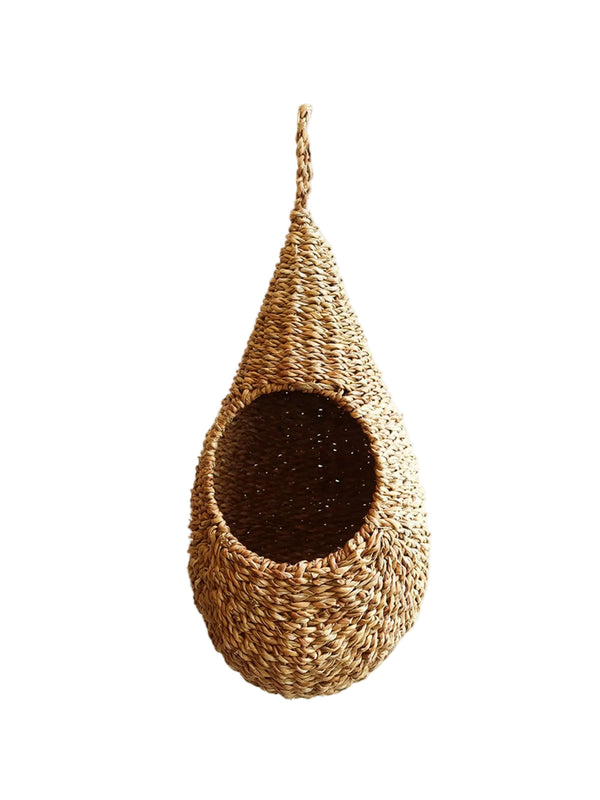 Woven hanging bird nest on a white background