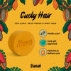 Yellow soap bar with 'Nanah' branding on a yellow background with cacao bean illustrations. Sulfate-free curly hair shampoo bar with argan oil, vegetable keratin & nopal extract — Curly Girl Method approved. Defines curls, fights frizz. Perfect curl gift.