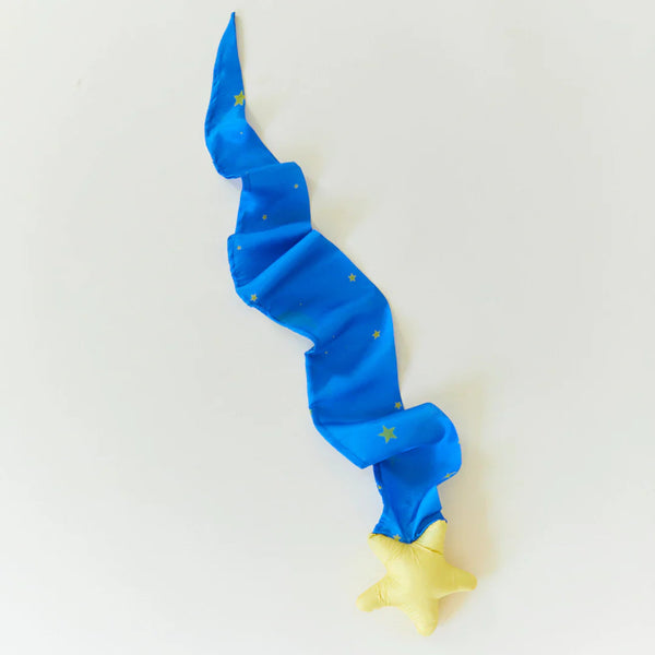 Blue and yellow toy with star patterns on a light gray background