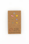 Close-up of colourful mismatched enamel stud earrings, nickel-free and ethically made in India