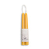 Yellow candles in a white holder with Bluecorn branding on a white background