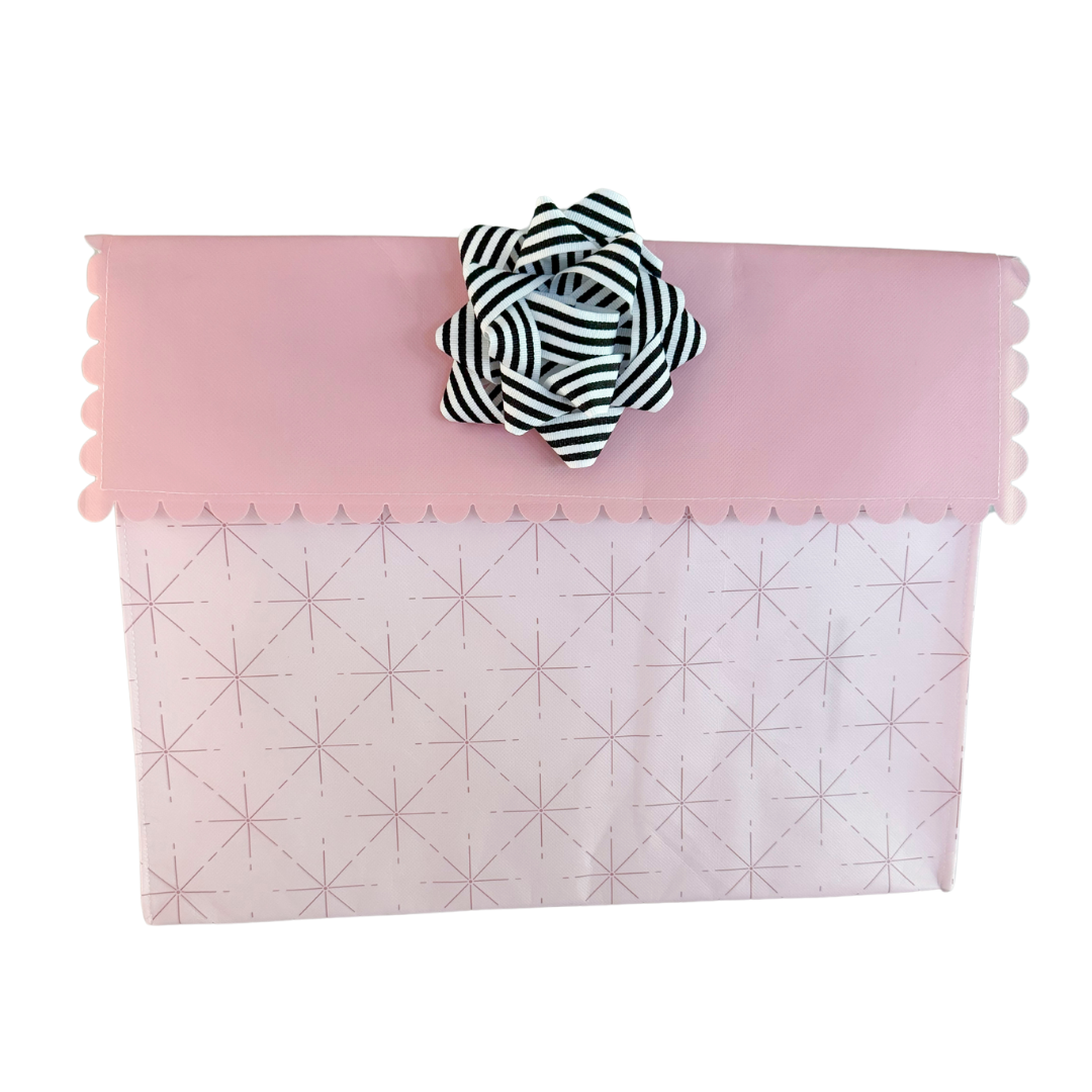 Close-up of black EverBow 5 inch grosgrain bow attached to an EverWrap gift bag