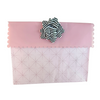 Close-up of black EverBow 5 inch grosgrain bow attached to an EverWrap gift bag
