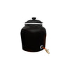 Black ceramic water dispenser with a spigot on a white background