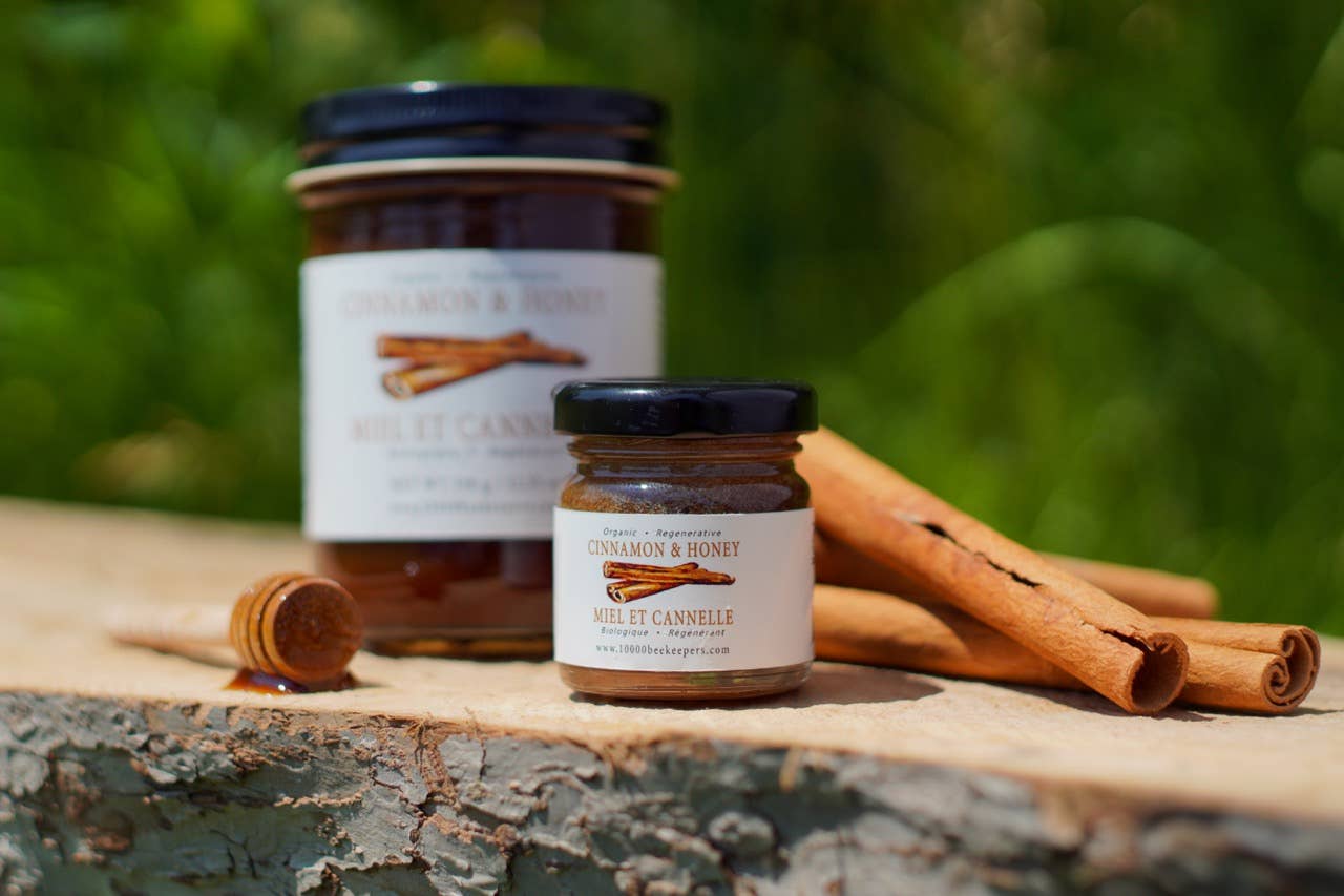 Organic cinnamon honey jar on a wooden surface, 350g fair trade honey from Tanzania