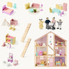 Wooden dollhouse with miniature furniture and accessories on a white background
