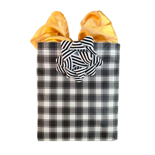 EverBow black ribbon bow styled on a wrapped gift with EverWrap EverBag
