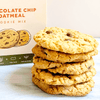 Stack of chocolate chip oatmeal cookies with a box in the background