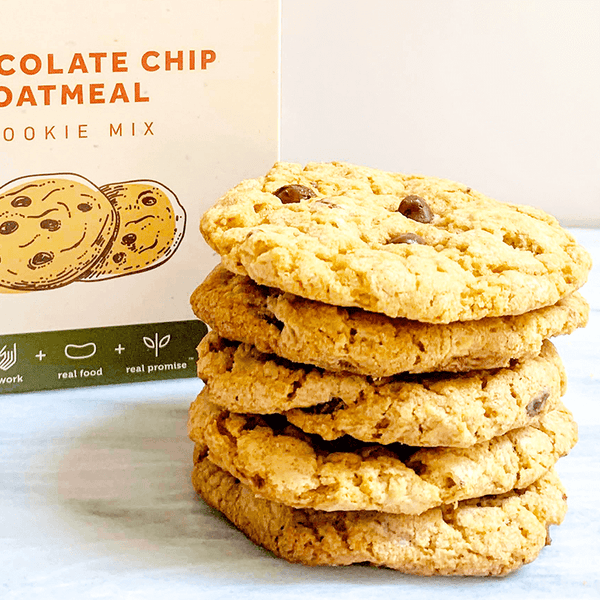Stack of chocolate chip oatmeal cookies with a box in the background