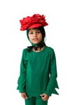 Child wearing a green outfit with a red floral headpiece on a white background
