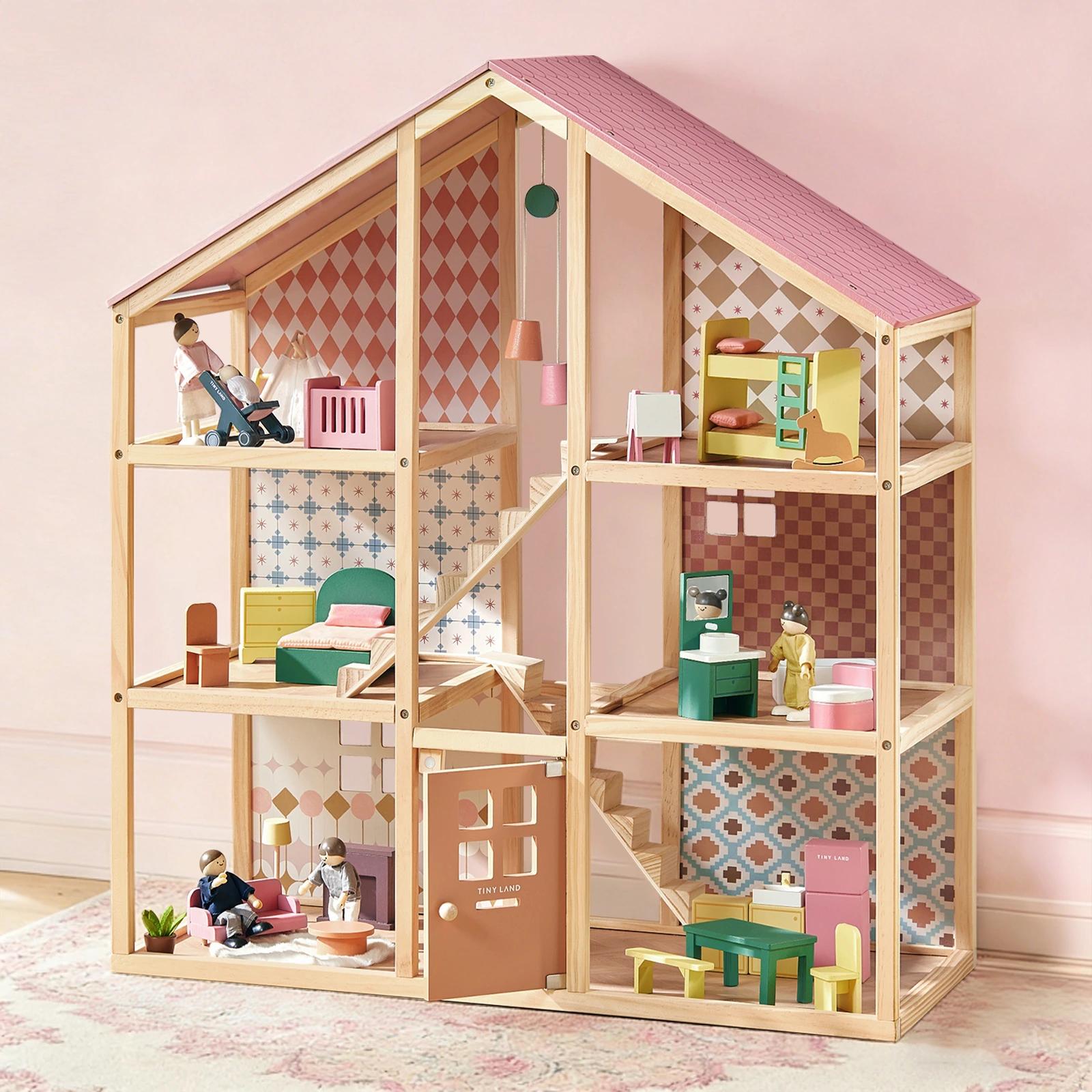 Sweetwood Pegasus dollhouse shown with its wooden furniture and family dolls