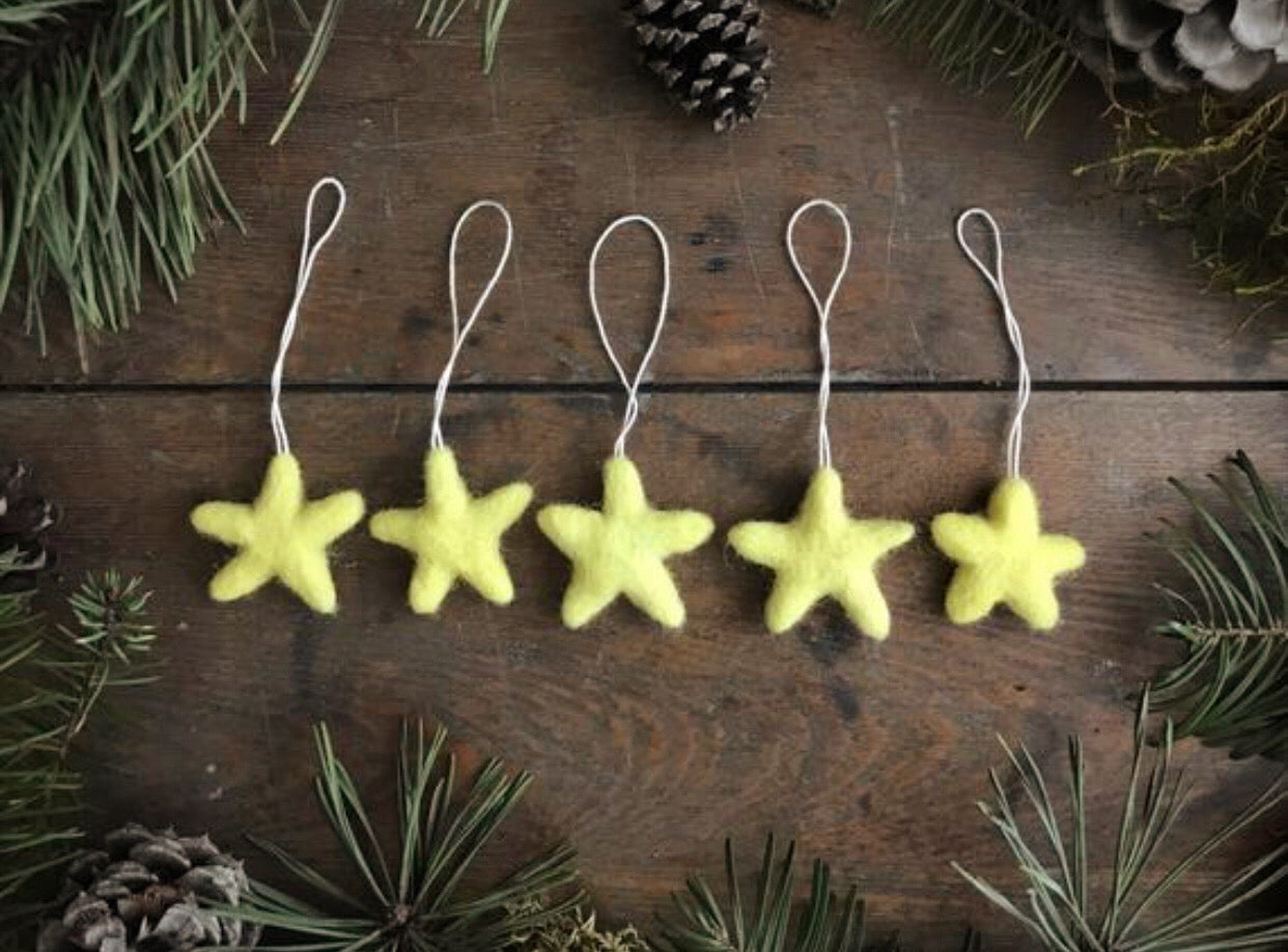 Set of five needle-felted wool star ornaments in Mahonia Yellow from House of Moss