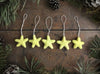 Set of five needle-felted wool star ornaments in Mahonia Yellow from House of Moss