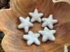 Felted wool stars in Morning Blue showing their varied shapes and sizes