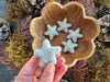 Close-up of needle-felted wool stars in Morning Blue