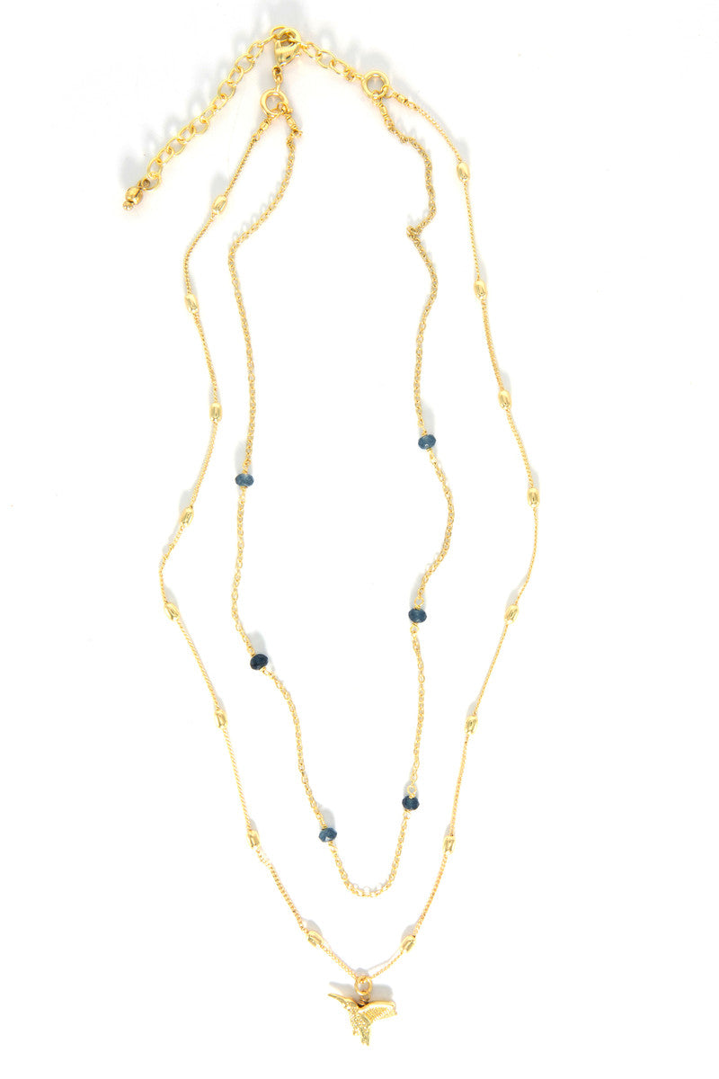 Hummingbird Lapis Convertible Necklace worn as two strands — lapis stone chain and hummingbird pendant chain in brass-plated recycled metal