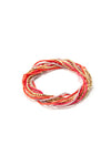 Stacked handmade glass and brass bead bracelets from the Fair Anita Celebration Elastic Bracelet Set