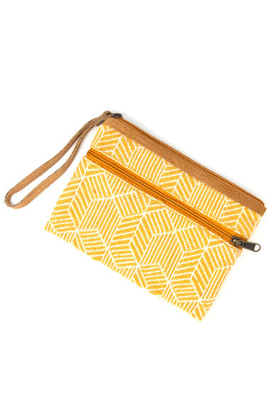 Close-up of Geometric Goldenrod Clutch Bag showing mustard cotton lining and zipper detail, sustainable fair trade accessory
