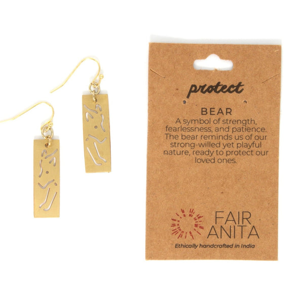 Animal cut out earrings styled on a model showing scale and wearability