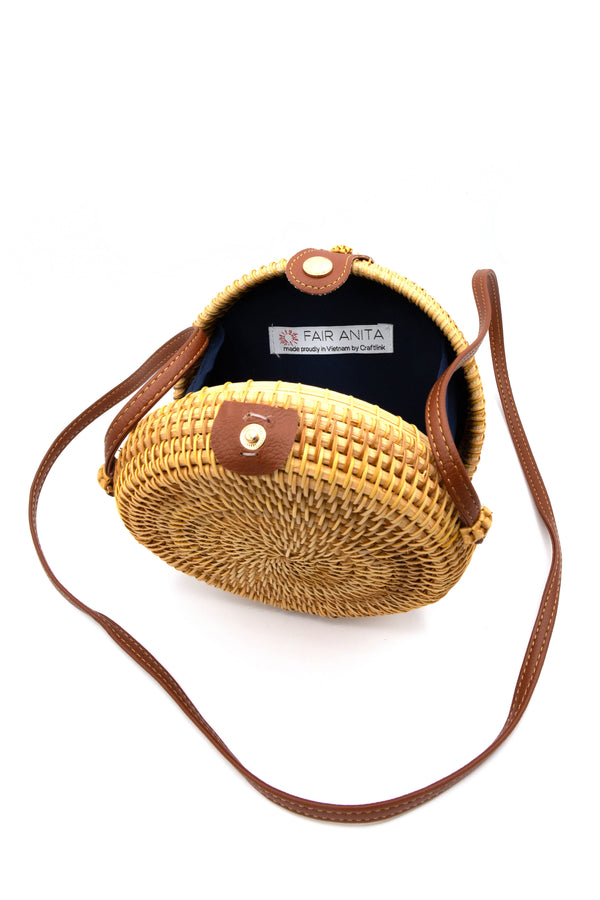 Fair Anita rattan round bag front view showing compact 7-inch circular silhouette