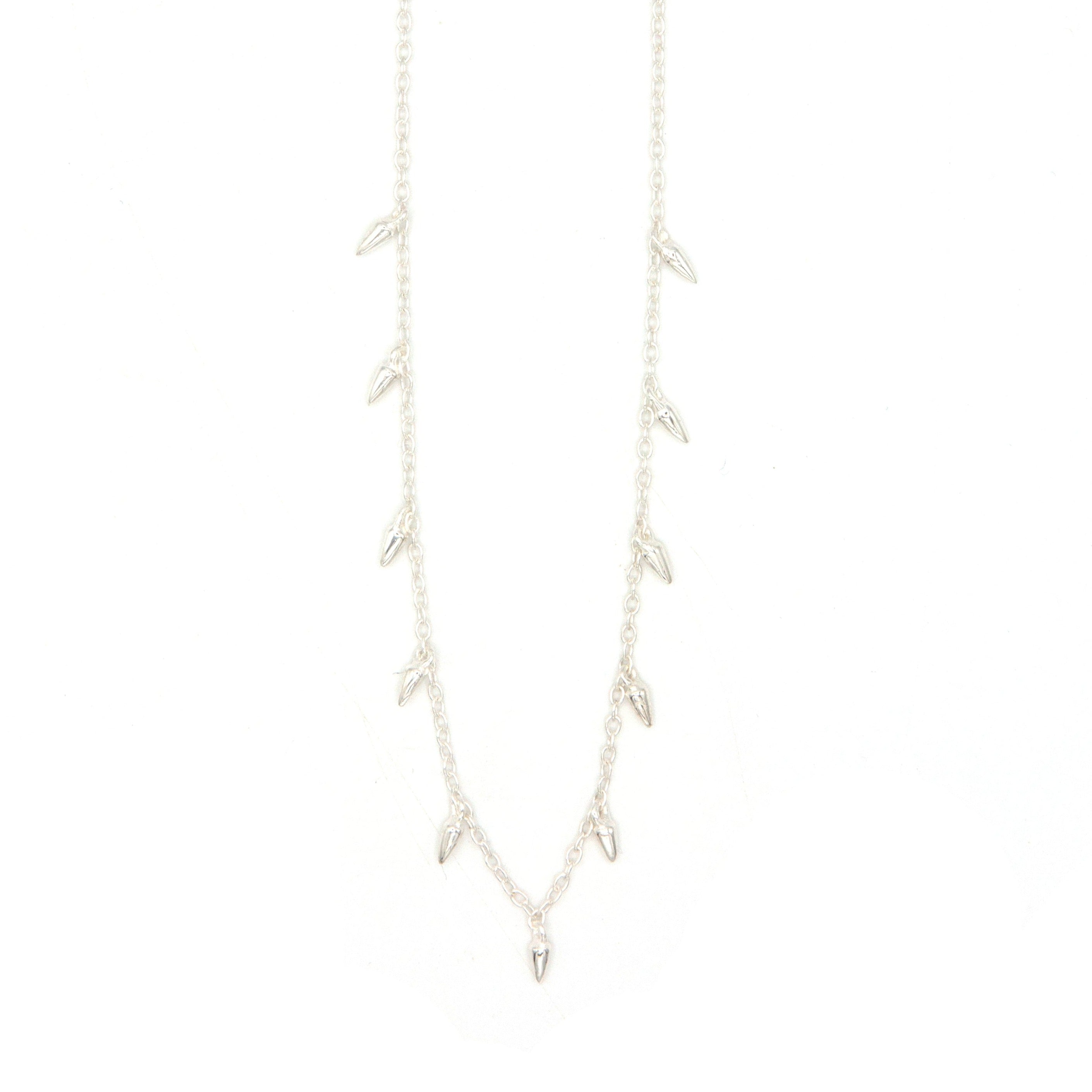 Fair Anita Spike Charm Necklace in sterling silver worn on model, 16 inch adjustable chain