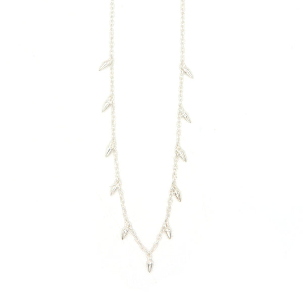 Fair Anita Spike Charm Necklace in sterling silver worn on model, 16 inch adjustable chain
