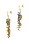 Close-up of iolite semi-precious stone cluster earrings showing violet-blue gemstone detail