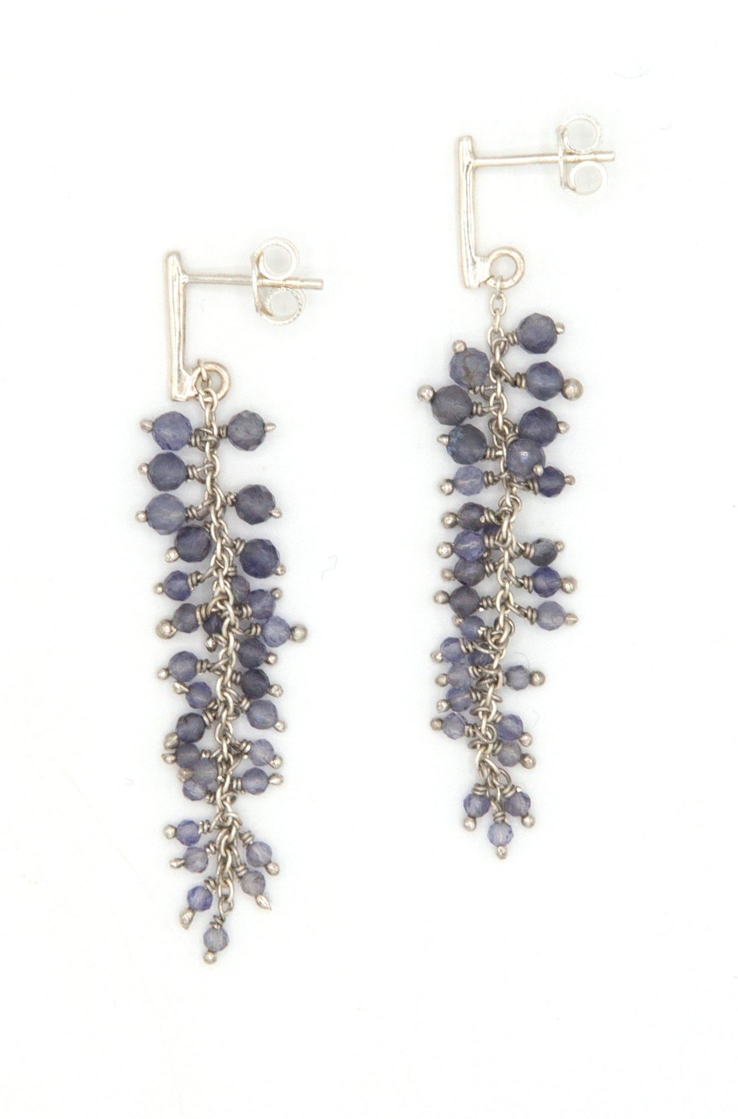 Model wearing iolite cluster drop earrings by Fair Anita, fair trade jewellery
