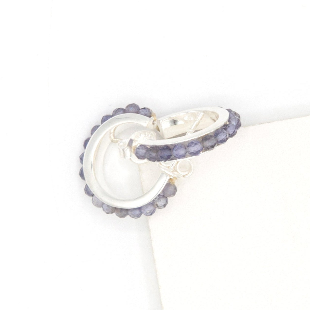 Fair trade iolite stone sterling silver hoops styled as a gift, ethically made by women artisans