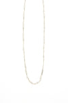 Woman wearing 19 inch twisted snake chain necklace layered with other necklaces