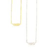 Fair trade fern necklace in gold-plated recycled brass on model