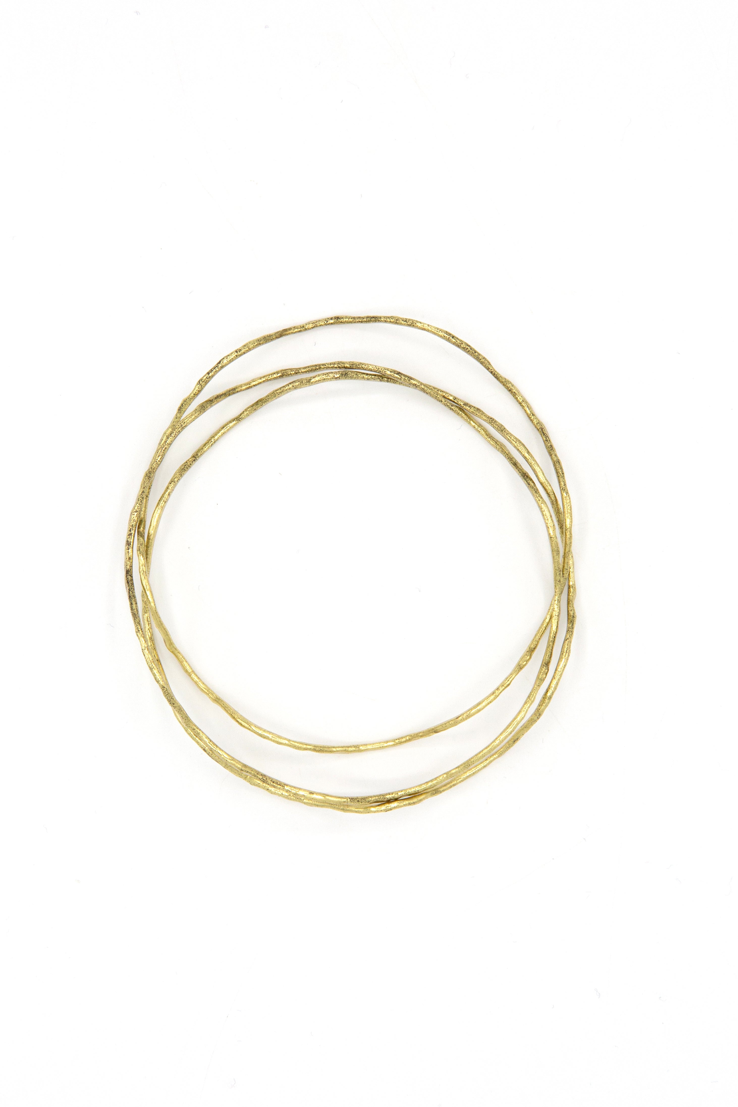 Tidalwave Hammered Brass Bangle Set worn stacked on wrist – sustainable fair trade jewellery by Fair Anita