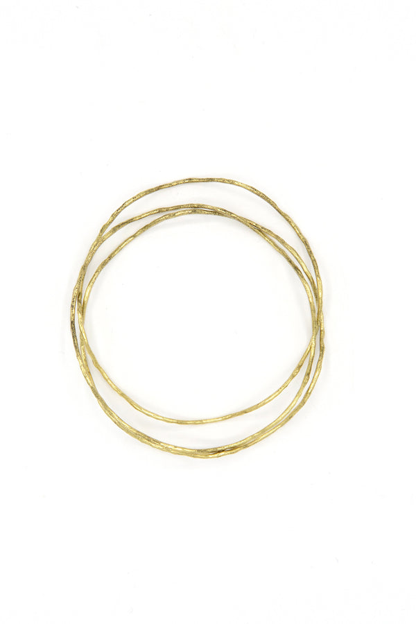 Tidalwave Hammered Brass Bangle Set worn stacked on wrist – sustainable fair trade jewellery by Fair Anita