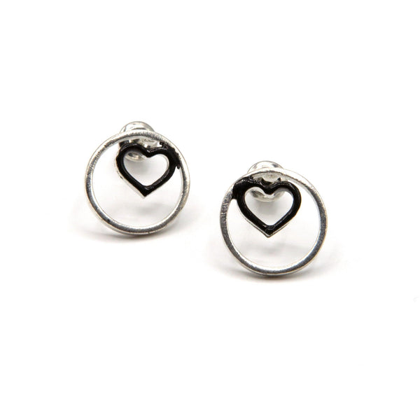 Heart Within stud earrings in silver-plated recycled metal with enamel heart detail by Fair Anita