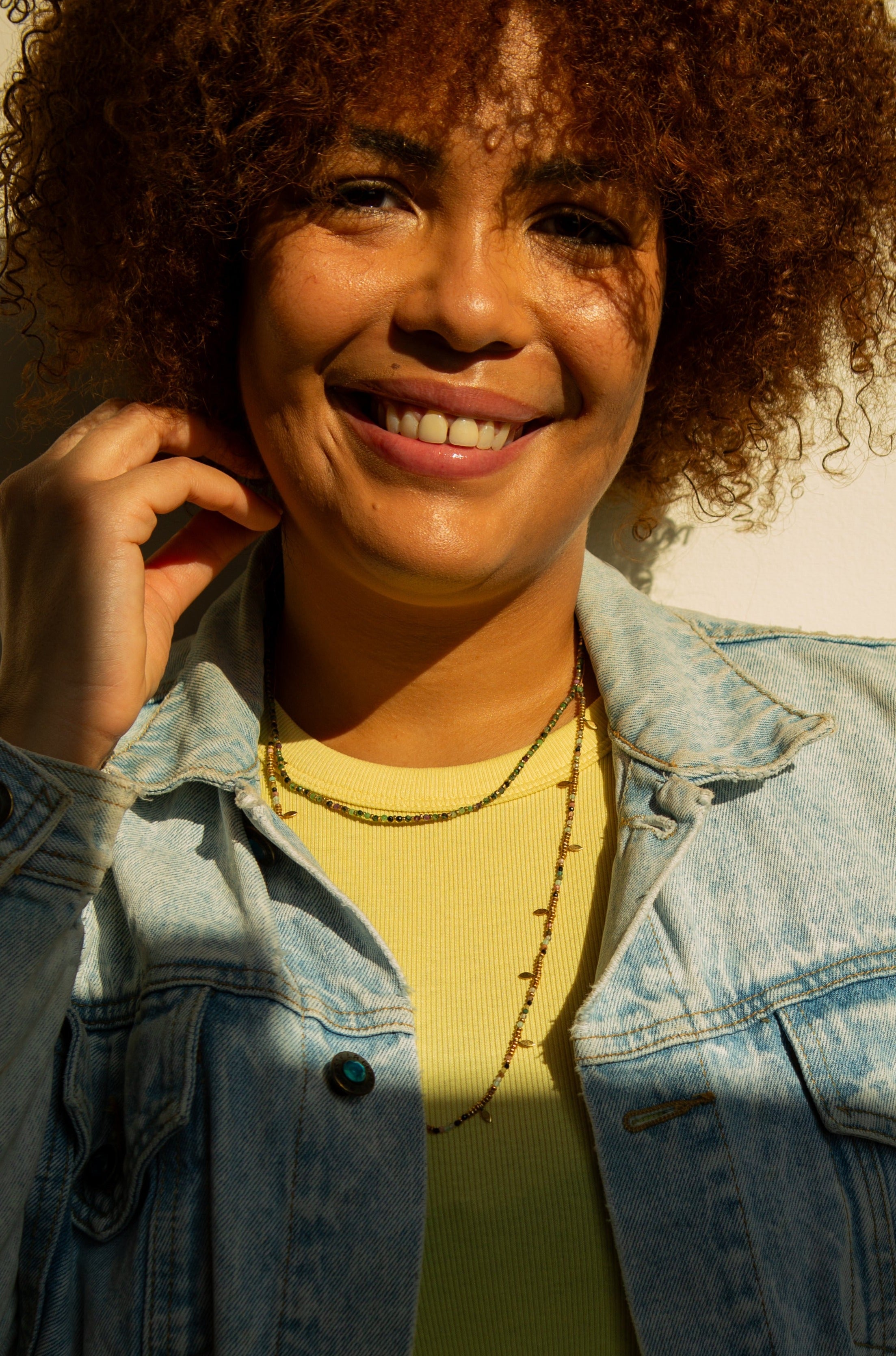 Close-up of Spring Equinox adjustable necklace showing semi-precious stone detail and brass finish