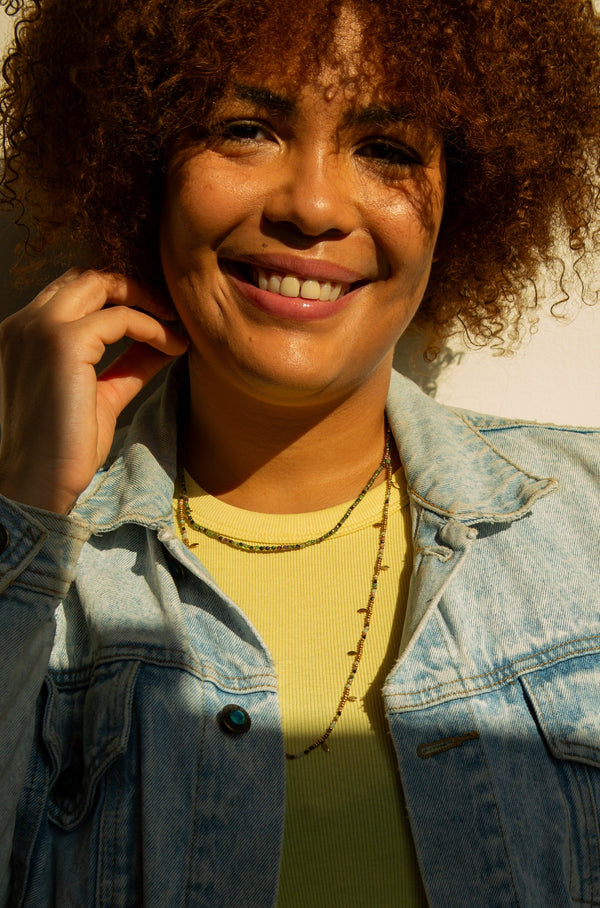 Close-up of Spring Equinox adjustable necklace showing semi-precious stone detail and brass finish
