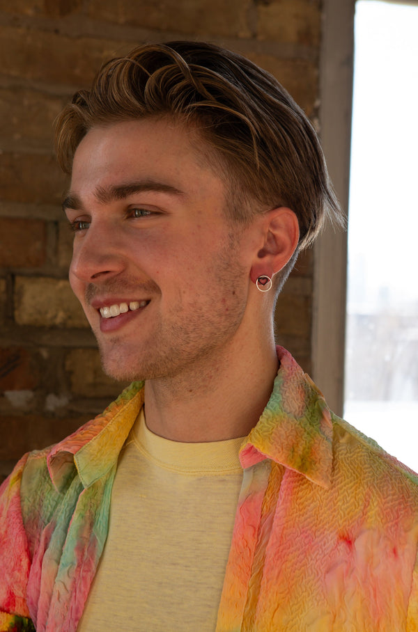 Close-up of Heart Within stud earrings showing enamel finish and silver plating, nickel-free