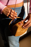 Close-up of woven rattan texture on Fair Anita round bag, sustainably made in Vietnam